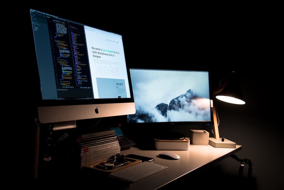 Evening studio desk with design work on screen